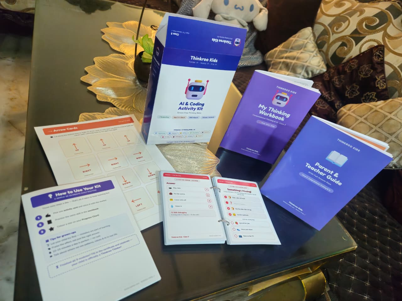 The Class 3 kit laid out: the box, a ring-bound card book, arrow cards, a how-to sheet, the thinking workbook and the parent and teacher guide